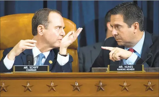  ?? Saul Loeb Pool Photo ?? INTELLIGEN­CE COMMITTEE Chairman Adam B. Schiff (D-Burbank), left, and ranking member Devin Nunes (R-Tulare) confer during Wednesday’s hearing.