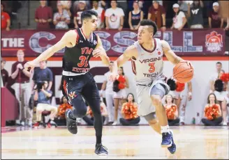  ??  ?? Wabissa Bede #3 of the Virginia Tech Hokies dribbles down the court while being defended by Sarju Patel #31 ofthe VMI Keydets at Cassell Coliseum on Dec 5 in Blacksburg, Virginia. (AFP)