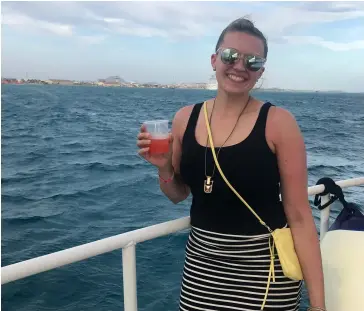  ?? PHOTO: © KATIE SKRZEK ?? Global Experience:
Katie on a sunset cruise in Aruba