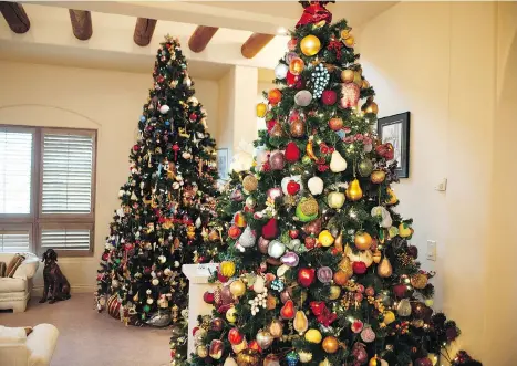  ?? PHOTOS: MIKE BELL ?? Joyce Wilson has 17 Christmas trees in her Richmond home and nine outside, adorned with ornaments collected over 40 years.