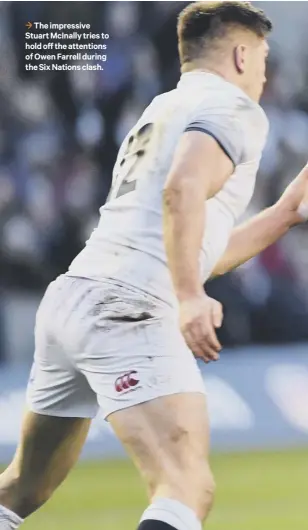  ??  ?? 3 The impressive Stuart Mcinally tries to hold off the attentions of Owen Farrell during the Six Nations clash.