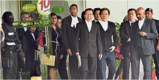  ??  ?? Looking at clues: Defence lawyers leaving the Chemistry Department in Petaling Jaya.