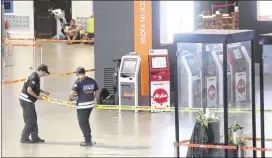  ?? CHINA PRESS ?? Police cordon off an area with tape for a police re-enactment with a suspect in the murder of Kim Jong Nam early Friday at Kuala Lumpur Internatio­nal Airport in Sepang, Malaysia. South Korea has accused North Korea of dispatchin­g a hit squad to kill Kim.