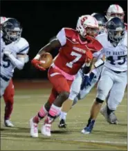  ?? GENE WALSH — DIGITAL FIRST MEDIA ?? Souderton’s Tre Samuels III gains yards after a Council Rock North fumble Friday night.