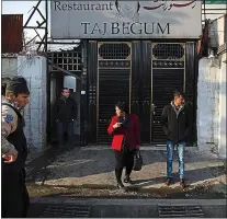  ?? PHOTOS BY KIANA HAYERI — THE NEW YORK TIMES ?? Laila Haidari, center, instructs some of her staff on what to do while she’s gone as she leaves her restaurant, Taj Begum, in Kabul.