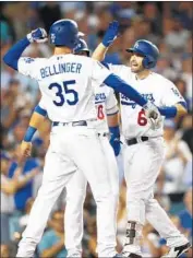  ?? Kent Nishimura Los Angeles Times ?? CODY BELLINGER celebrates a three-run homer by Brian Dozier, right, one of seven L.A. home runs.