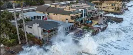  ?? JEFF GRITCHEN — THE ORANGE COUNTY REGISTER, FILE ?? Homes along Capistrano Beach get pelted with waves during high tide in Dana Point on Aug. 19, 2021. California’s Coastal Commission has approved a desalinati­on plant for Dana Point, southeast of Los Angeles.