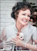  ?? The Associated Press ?? Betty White with a puppy from her 1970s series “The Pet Set.”