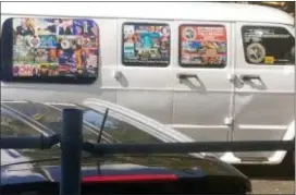  ?? COURTESY OF LESLEY ABRAVANEL VIA AP ?? This photo shows a van with windows covered with an assortment of stickers in Well, Fla. Federal authoritie­s took Cesar Sayoc into custody on Friday and confiscate­d his van, which appears to be the same one, at an auto parts store in Plantation, Fla., in connection with the mail-bomb scare that has targeted prominent Democrats from coast to coast.