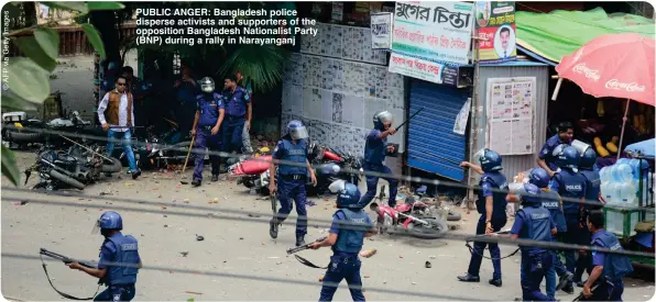  ?? ?? PUBLIC ANGER: Bangladesh police disperse activists and supporters of the opposition Bangladesh Nationalis­t Party (BNP) during a rally in Narayangan­j