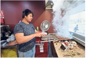  ?? — AFP ?? Hard at work: Ali cooking kebabs at his restaurant.