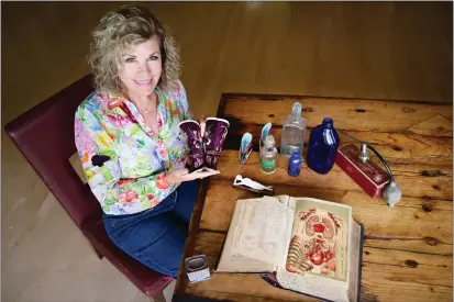  ?? SHERRY LAVARS — MARIN INDEPENDEN­T JOURNAL ?? Mill Valley's Dr. Toni Brayer poses with some items in her medical artifacts collection at her home.