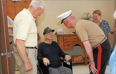  ?? GENE WALSH — DIGITAL FIRST MEDIA ?? Lt. General Richard P. Mills greets World War II veteran Louis Rittelmann, who was honored for his service during a ceremony at Phoenixvil­le Care and Rehab Center.