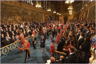  ?? ?? DELIVERING CHANGE: Charles and Camilla lead the way at the State Opening of Parliament