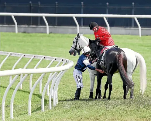  ?? GETTY IMAGES ?? Ryan Moore checks Cliffs Of Moher who broke down in the first lap in race 7 during Melbourne Cup Day.