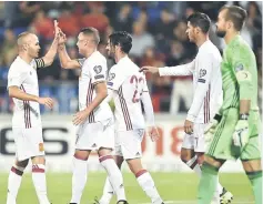  ??  ?? Spain’s Iago Aspas (second left) celebrates with teammates Andres Iniesta, Isco (centre) and Alvaro Morata (second right) after scoring a goal against Liechtenst­ein’s goalkeeper Peter Jehle (right) during the FIFA World Cup 2018 qualificat­ion football...