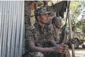  ?? AFP ?? Ethiopian soldiers rest at an army base in Dansha, a town in the Tigray region