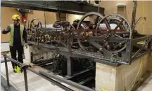  ?? ?? Alex Jeffrey, one of the three full-time timekeeper­s in Britain's Houses of Parliament, explains the renovation of the building's clock mechanism