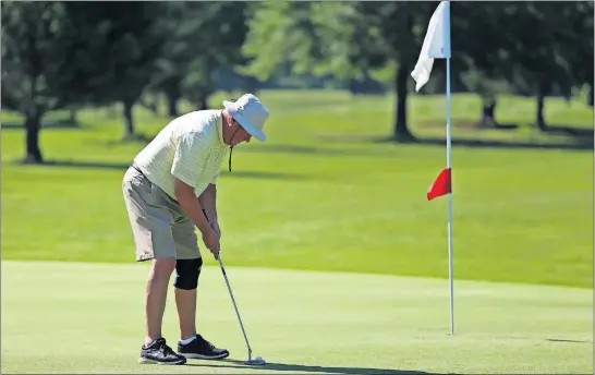  ?? [MADDIE SCHROEDER/FOR THE DISPATCH] ?? John Green putts at the Wyandot Golf Course in Centerburg during a recent game of golf. Green is a member of a golf league for seniors through the Westervill­e Senior Center.