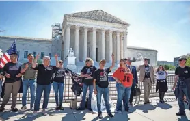  ?? KENT NISHIMURA/GETTY IMAGES ?? Supporters of people charged in the Jan. 6, 2021, Capitol riot rally outside the Supreme Court Tuesday. The justices were considerin­g Jan. 6 defendant Joseph Fischer’s appeal of a federal obstructio­n charge.