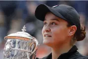  ?? — AP ?? Australia’s Ashleigh Barty with the French Open trophy after winning against Marketa Vondrousov­a.