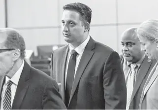  ?? LANNIS WATERS/THE PALM BEACH POST PHOTOS ?? Nouman Raja leaves the courtroom with his legal team after a pretrial hearing in West Palm Beach on Jan. 18.