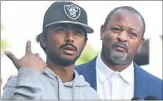  ?? BRITTANY MURRAY — STAFF PHOTOGRAPH­ER ?? Social activist Najee Ali on Wednesday stands with Rafeul Chowdhury, boyfriend of Mona Rodriguez, who was shot by a school safety officer Monday in Long Beach.