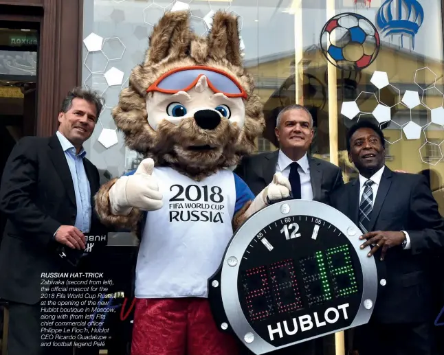  ??  ?? RUSSIAN HAT-TRICK Zabivaka (second from left), the official mascot for the 2018 Fifa World Cup Russia, at the opening of the new Hublot boutique in Moscow, along with (from left) Fifa chief commercial officer Philippe Le Floc’h, Hublot CEO Ricardo...