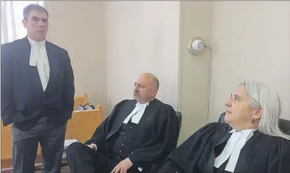  ?? BARB SWEET/THE TELEGRAM ?? Lawyer for former orphanage residents Geoff Budden (left) chats with church lawyers Chris Blom and Susan Adam Metzler at the Mount Cashel civil trial Friday.