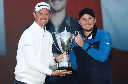  ??  ?? Tournament host Justin Rose presents the British Masters trophy to Eddie Pepperell after his victory yesterday