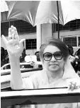  ?? — AFP photo ?? Khaleda Zia waves as she leaves after a court appearance in Dhaka in this file photo.