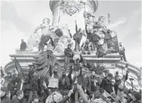  ?? REUTERS ?? French labour union members and workers on strike attend a demonstrat­ion in Paris as France faces its 13th day of consecutiv­e strikes against French government’s pensions reform plans on Tuesday.