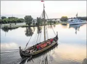  ?? JACOB HAMILTON / THE BAY CITY TIMES-MLIVE.COM VIA ASSOCIATED PRESS ?? The Draken Harald Harfagre departs Bay City on the Saginaw River on Wednesday. The vessel is to visit a series of ship festivals along the Great Lakes this summer.