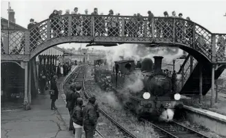  ?? ?? LSWR O2 0-4-4T No. W24 Calbourne heads the nascent Isle of Wight Steam Railway’s rolling stock out of Newport station on January 24, 1971, for the last time. IOWSR