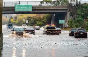  ?? Adam Pardee/Special to The Chronicle ?? Flooding reaches 3 feet on Highway 101 in South San Francisco on Jan. 31.