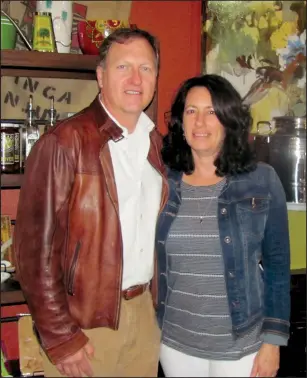  ?? STEVE ANDREWS / NWA DEMOCRATGAZETTE ?? Tom and Laura Gheen, standing inside their olive oil shop in Bentonvill­e, hope Ramo d’Olivo will provide a fun place for locals to eat, drink and “hang out.”