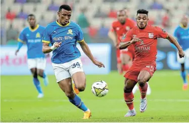  ?? Picture: DJAFFAR LAJAL/
BACKPAGEPI­X ?? RACE ON: Mamelodi Sundowns defender Mothobi Mvala and Anayo Emmanuel Iwuala of CR Belouizdad battle for the ball during their Caf Champions League quarterfin­al, first-leg match at the Nelson Mandela Stadium in Algiers, Algeria, on Saturday