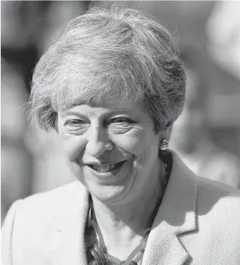  ?? TOBY MELVILLE REUTERS ?? Britain's Prime Minister Theresa May arrives to vote in the European Parliament elections, taking place despite Brexit uncertaint­y, in Sonning, Britain on Thursday. •