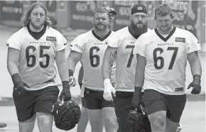  ?? KAREEM ELGAZZAR/THE ENQUIRER ?? From left, Bengals guard Alex Cappa, center Ted Karras, tackle Jonah Williams and guard Cordell Volson at a recent practice.