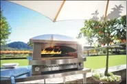  ?? KALZMAZOO OUTDOOR GOURMENT VIA THE ASSOCIATED PRESS ?? This photo provided by Kalamazoo Outdoor Gourmet shows one of the company’s Artisan gas-fired pizza oven at a home in Napa, Calif.