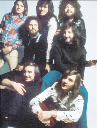  ?? Michael Putland
Getty Images ?? ELO IN 1975, clockwise from top left, Hugh McDowell, Kelly Groucutt, Bev Bevan, Jeff Lynne, Mik Kaminski, Richard Tandy, Melvyn Gale. The group was a radio fixture in the late ’70s.