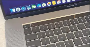  ?? Christoph Dernbach Picture-Alliance ?? THE NEW MacBook Pro comes with a Magic Keyboard that replaces the “butterf ly” keys that users of earlier models of the laptop have complained about for years. The new models start at $2,399, Apple said.