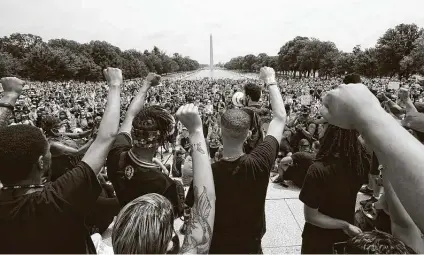  ?? Alex Brandon / Associated Press ?? Demonstrat­ors at the Lincoln Memorial in Washington, D.C., protest over the death of George Floyd. They toted flags, angry hand-lettered signs and their children in one of the biggest protests in the capital so far.