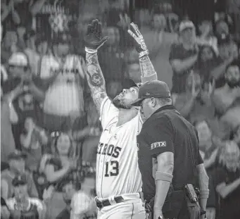  ?? Mark Mulligan/Staff photograph­er ?? Astros designated hitter J.J. Matijevic (13) celebrates at home plate after hitting a home run, his first major league hit, during the fourth inning on Sunday night.