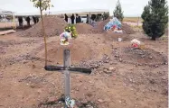  ?? MARCO UGARTE /ASSOCIATD PRESS ?? Graves are prepared for Rhonita Miller, 30, and four of her young children Krystal and Howard, and twins Titus and Tiana, who were murdered by drug cartel gunmen.