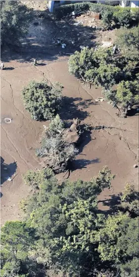  ?? Mel Melcon Los Angeles Times ?? a wall of mud, rocks and debris that raced down creek beds into residentia­l areas.