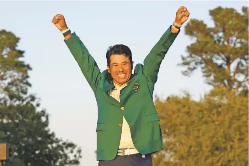  ?? GREGORY BULL/ASSOCIATED PRESS ?? Hideki Matsuyama of Japan celebrates after putting on the champion’s green jacket after winning the Masters on Sunday in Augusta, Ga.