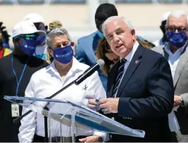  ?? MATIAS J. OCNER mocner@miamiheral­d.com ?? U.S. Rep. Carlos Gimenez, R-Fla., center, speaks during a press conference about the cruise and tourism industry at PortMiami on April 9.