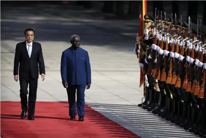  ?? ?? Chinese premier Li Keqiang and Solomon Islands prime minister Manasseh Sogavare in Beijing in October 2019. Photograph: Mark Schiefelbe­in/AP