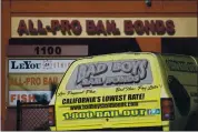  ?? DAI SUGANO — BAY AREA NEWS GROUP ?? A Bad Boys Bail Bonds’ truck and an All-Pro Bail Bonds’ store sign are seen on October 12 in San Jose.